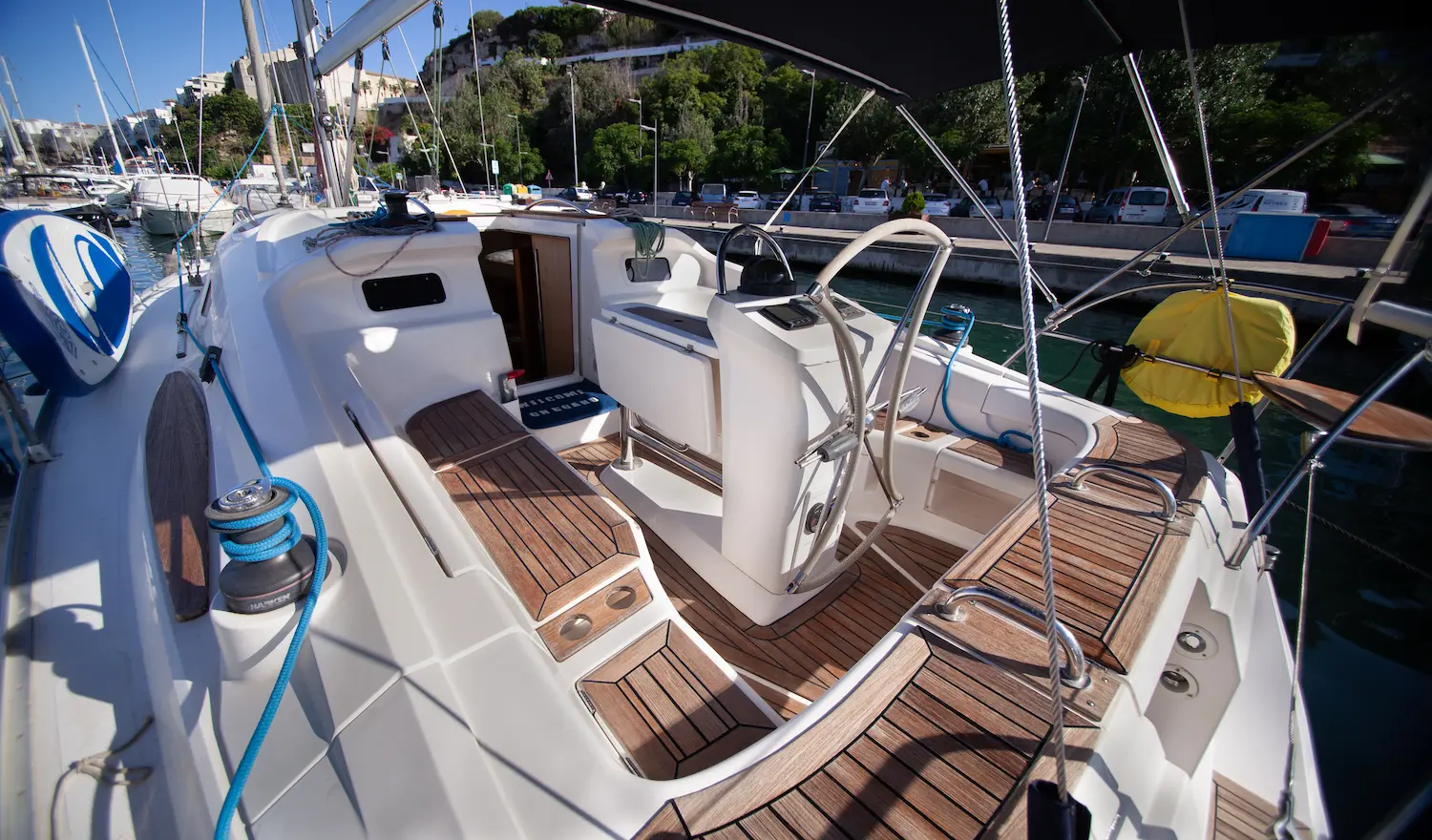 Teak cockpit and outdoor table of the Elan Impression 384 sailboat