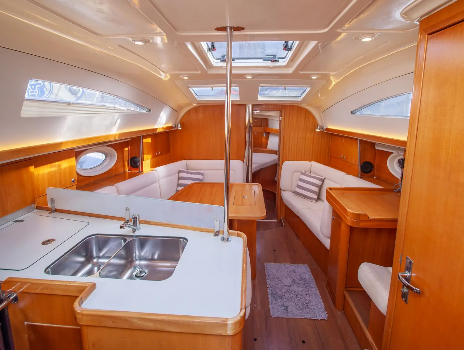 Equipped kitchen and saloon inside the Elan Impression 384 sailboat