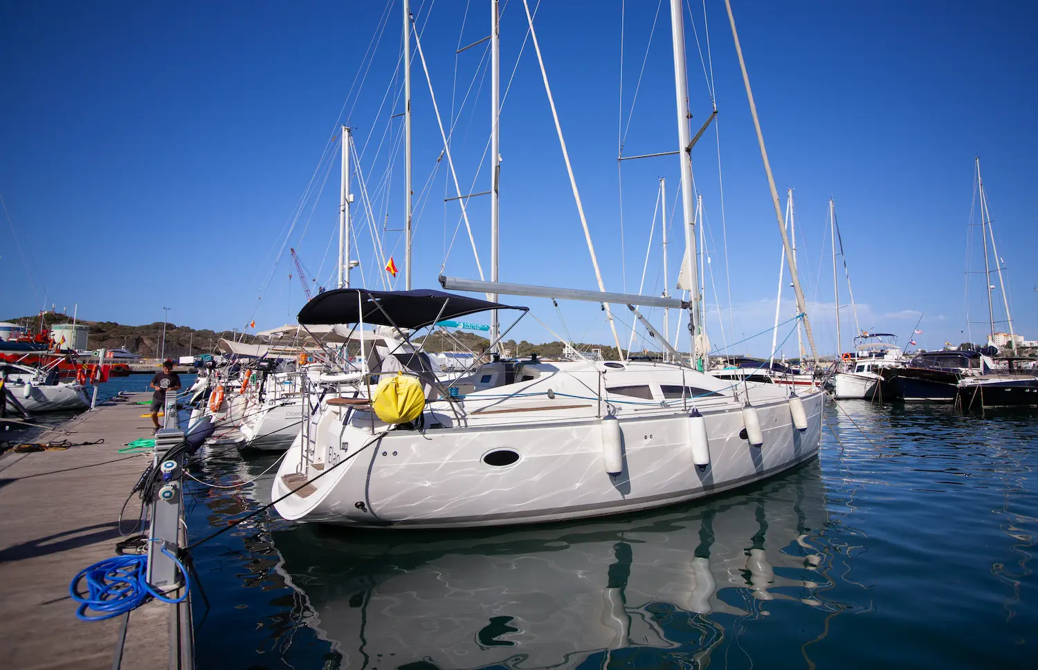 Elan sailboat moored at the pontoon in Mahón harbour